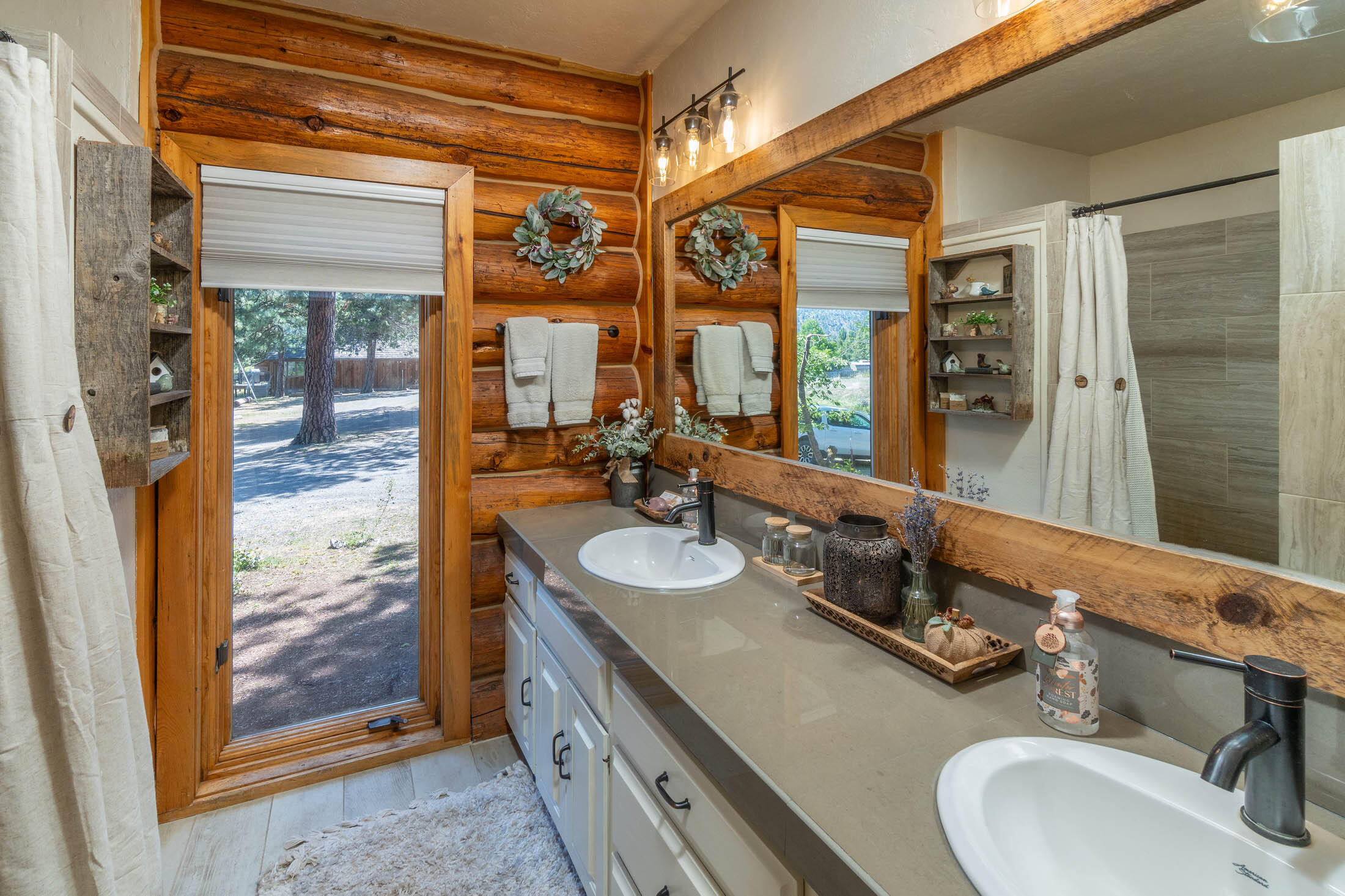32907 River Bend Road Chiloquin, OR 97624 - Photo 14 of 83 a bathroom with a double vanity sink and a mirror