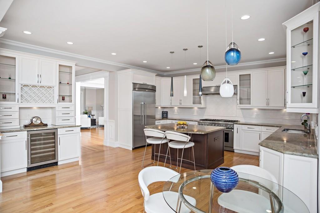 34 Dorothy Road Newton, MA 02459 - Photo 13 of 41 a kitchen with a sink cabinets and wooden floor