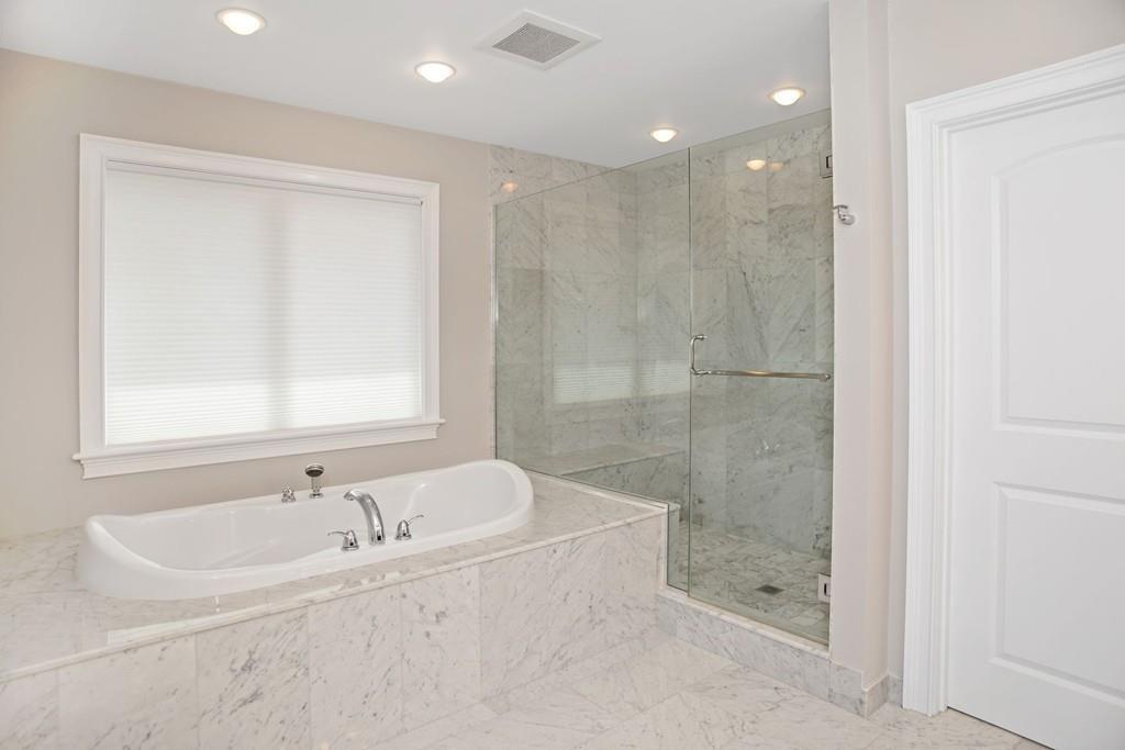 34 Dorothy Road Newton, MA 02459 - Photo 29 of 41 a bathroom with a bathtub and a shower