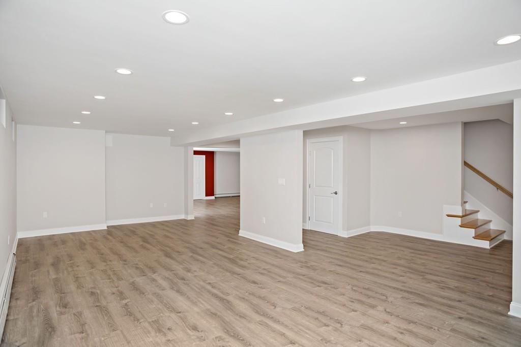 34 Dorothy Road Newton, MA 02459 - Photo 37 of 41 a view of an empty room with wooden floor and a window