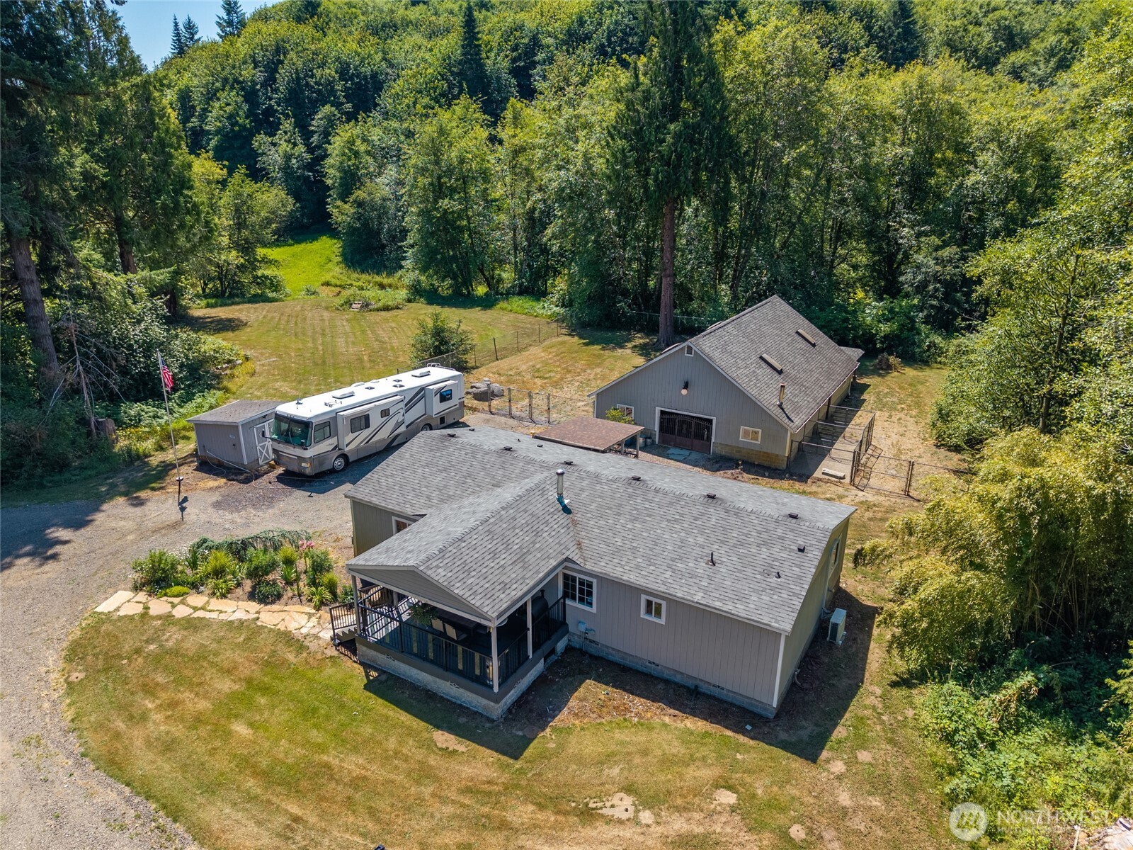 19619 Michigan Hill Road Southwest Rochester, WA 98579 - Photo 30 of 40 an aerial view of a house with swimming pool and a yard