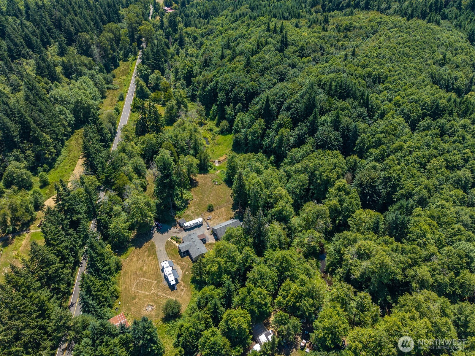 19619 Michigan Hill Road Southwest Rochester, WA 98579 - Photo 31 of 40 an aerial view of residential house with outdoor space and trees all around