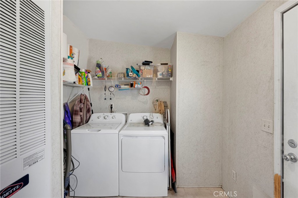 12837 Hacienda Road Phelan, CA 92371 - Photo 15 of 51 a utility room with dryer and washer