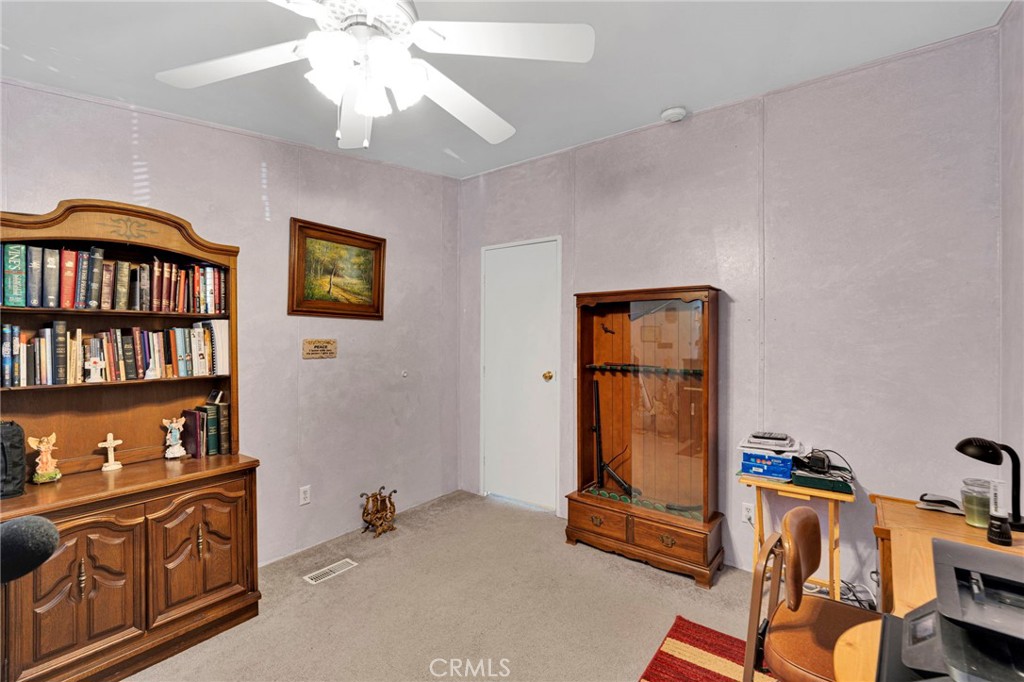 12837 Hacienda Road Phelan, CA 92371 - Photo 17 of 51 a view of room with workspace and a window