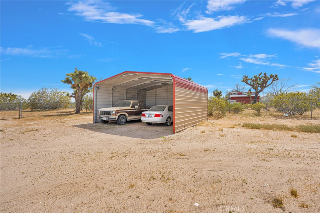 12837 Hacienda Road Phelan, CA 92371 - Photo 28 of 51 a car parked on the side of the road