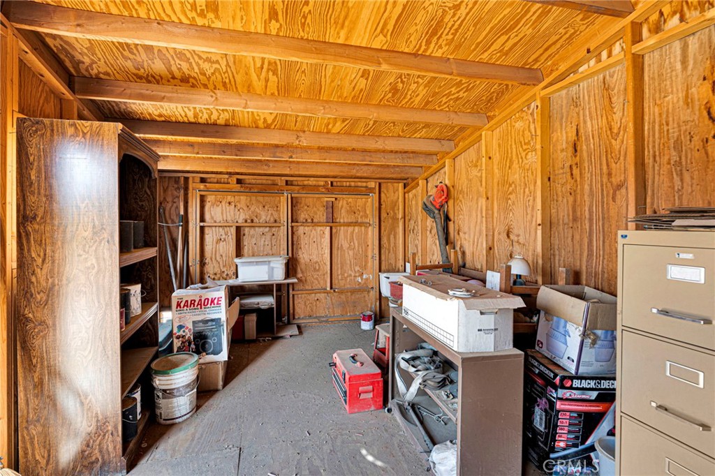 12837 Hacienda Road Phelan, CA 92371 - Photo 30 of 51 a room with furniture and a window