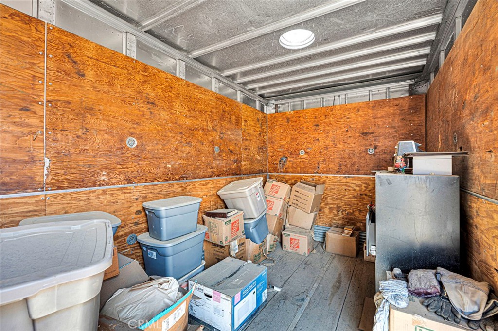 12837 Hacienda Road Phelan, CA 92371 - Photo 34 of 51 a balcony with furniture and wooden floor