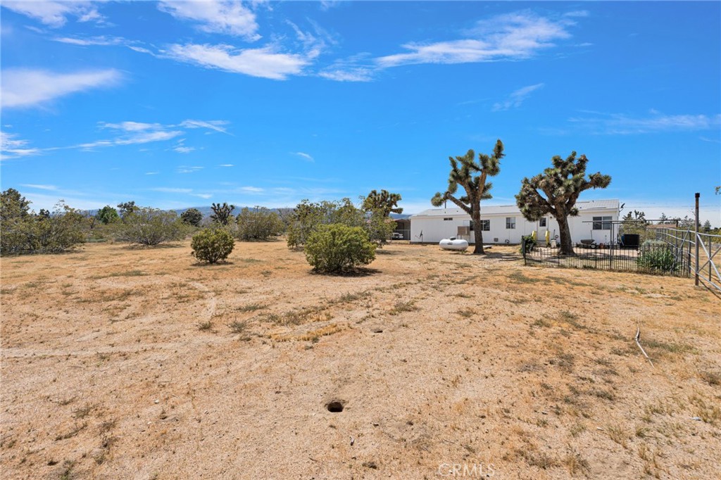 12837 Hacienda Road Phelan, CA 92371 - Photo 36 of 51 a view of a lake with a house