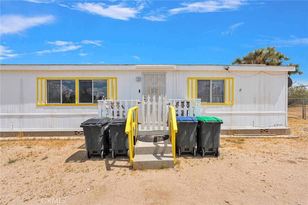 12837 Hacienda Road Phelan, CA 92371 - Photo 4 of 51 a view of a house with patio