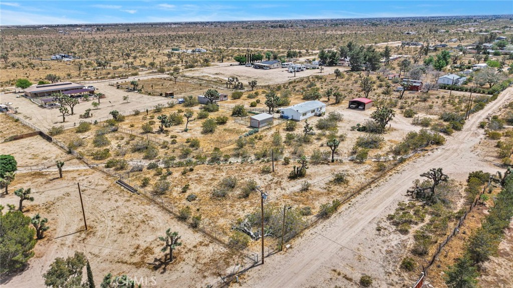 12837 Hacienda Road Phelan, CA 92371 - Photo 46 of 51 an aerial view of residential houses with outdoor space