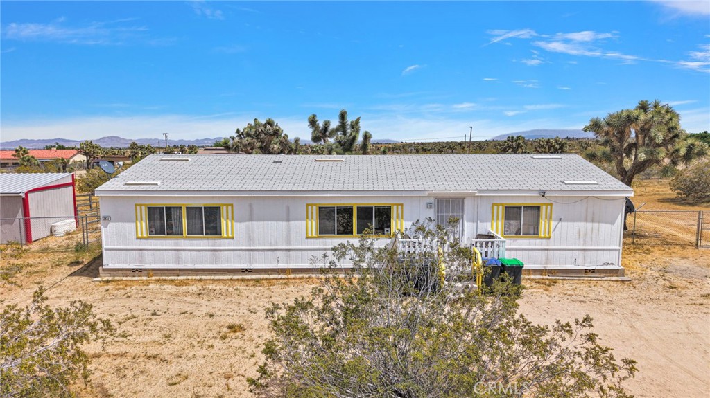 12837 Hacienda Road Phelan, CA 92371 - Photo 50 of 51 front view of house with a yard
