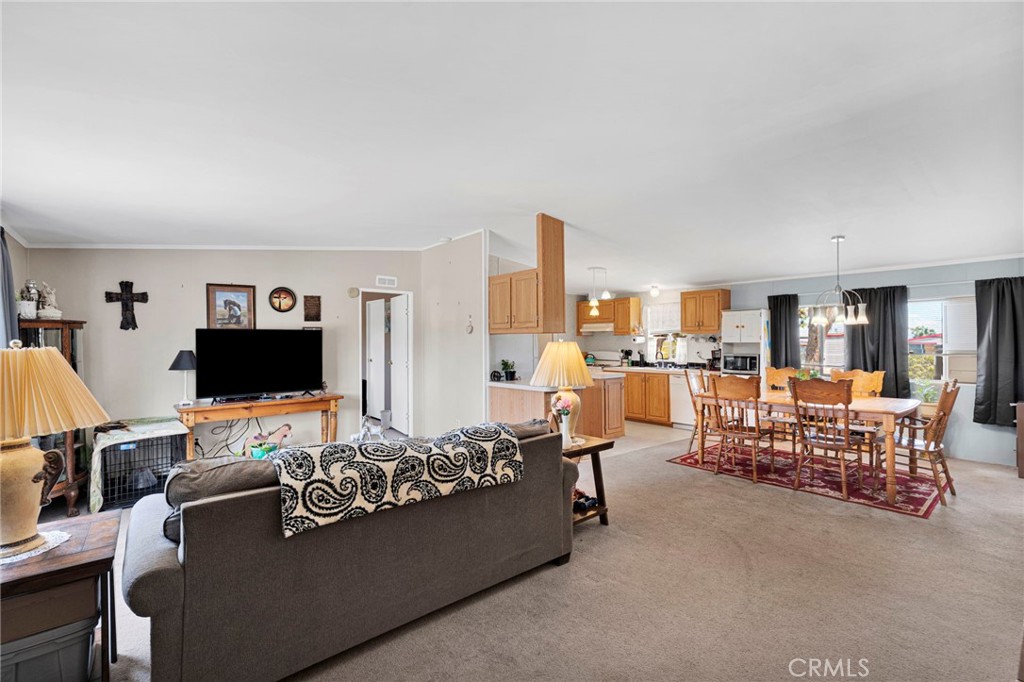 12837 Hacienda Road Phelan, CA 92371 - Photo 5 of 51 a living room with furniture and a flat screen tv