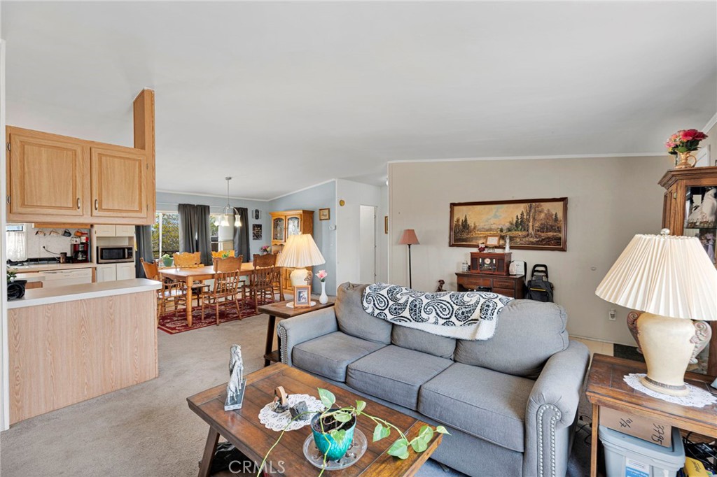 12837 Hacienda Road Phelan, CA 92371 - Photo 8 of 51 a living room with furniture and a table