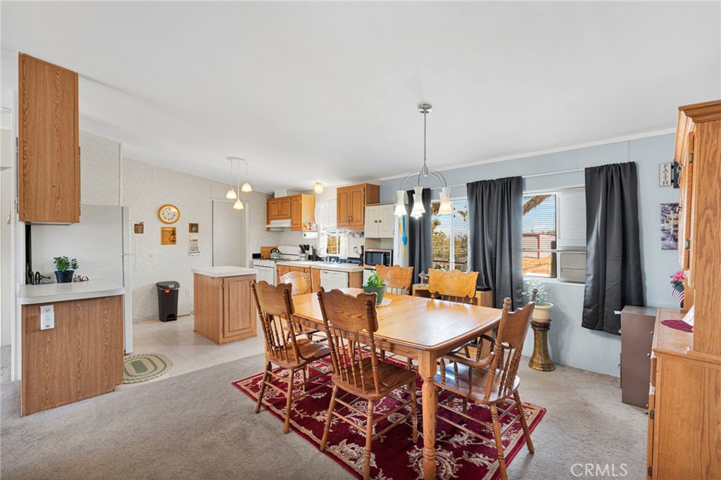 12837 Hacienda Road Phelan, CA 92371 - Photo 9 of 51 a view of a dining room with furniture
