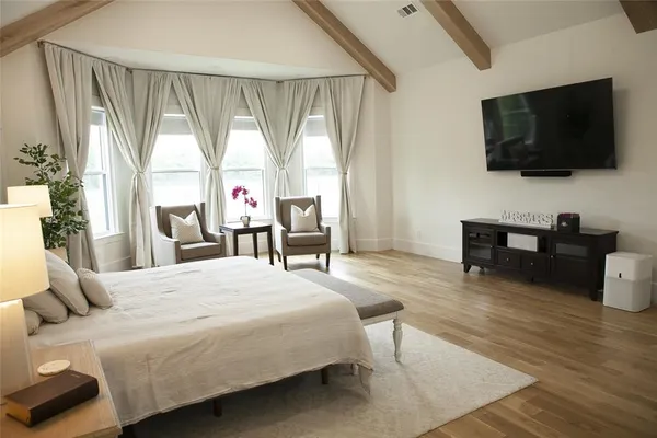 a spacious bathroom with a double vanity sink double mirror and bathtub