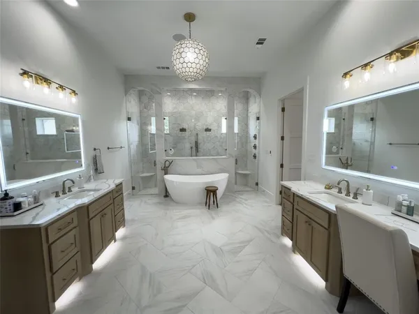 a bathroom with a tub sink and mirror