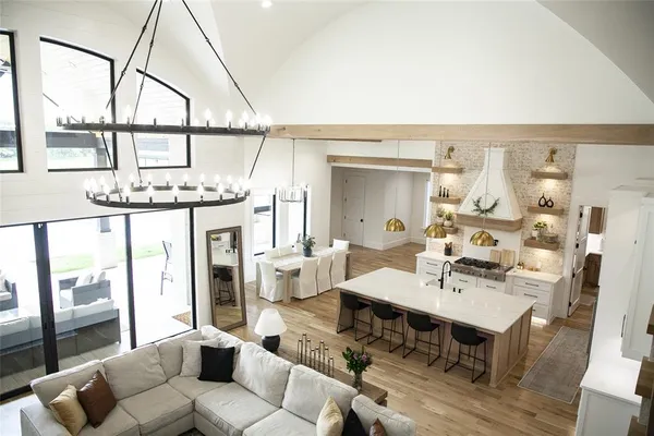 a living room with furniture a window and a table