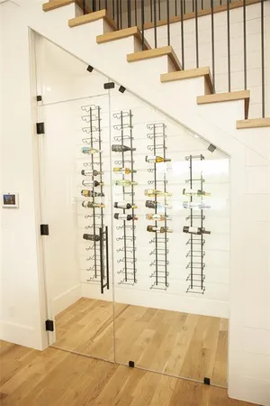 a view of a hallway view with wooden floor and staircase
