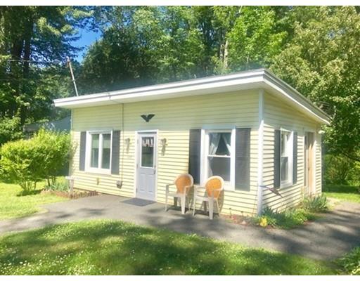 64 State Road Whately, MA 01373 - Photo 12 of 29 a front view of a house with a yard glass top table and chairs