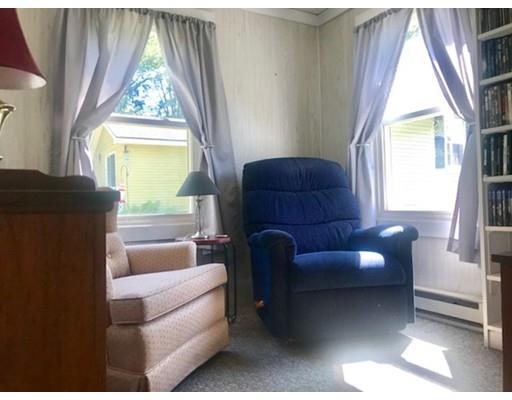64 State Road Whately, MA 01373 - Photo 16 of 29 a living room with furniture and a window