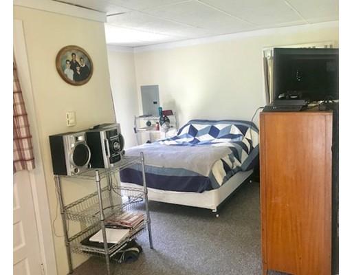 64 State Road Whately, MA 01373 - Photo 18 of 29 a bedroom with a bed and a flat screen tv