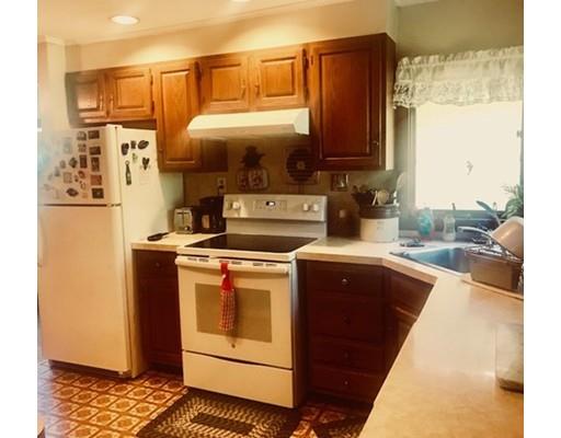 64 State Road Whately, MA 01373 - Photo 24 of 29 a kitchen with stainless steel appliances granite countertop a refrigerator a stove and a wooden cabinets