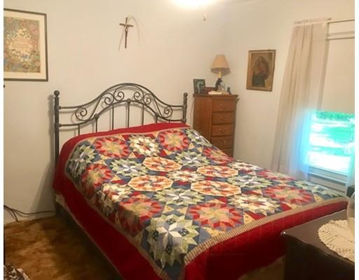 64 State Road Whately, MA 01373 - Photo 28 of 29 a bed sitting in a bedroom next to a window