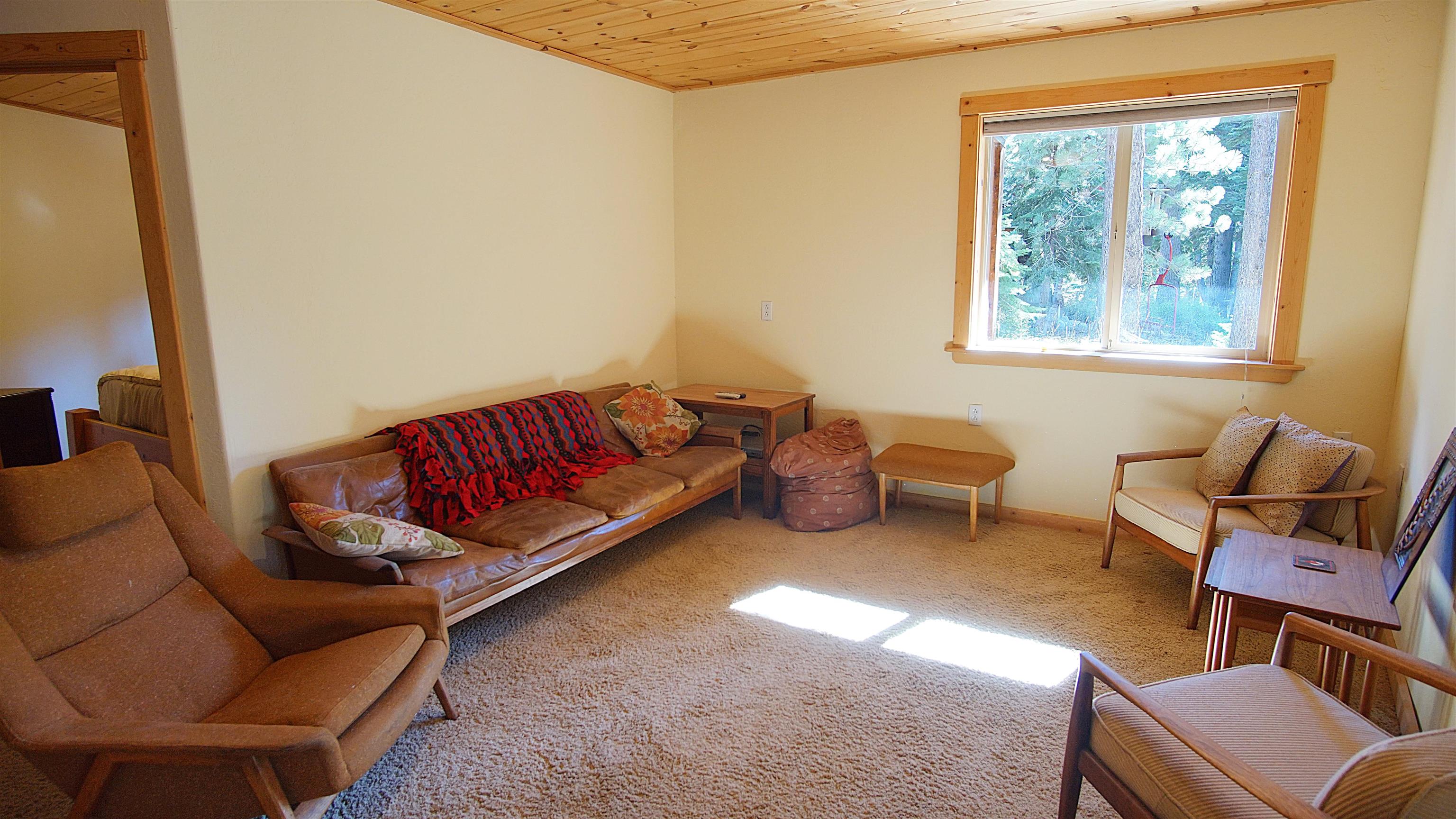 1557 Alpine Meadows Road Alpine Meadows, CA 96146 - Photo 23 of 28 a living room with furniture and a window