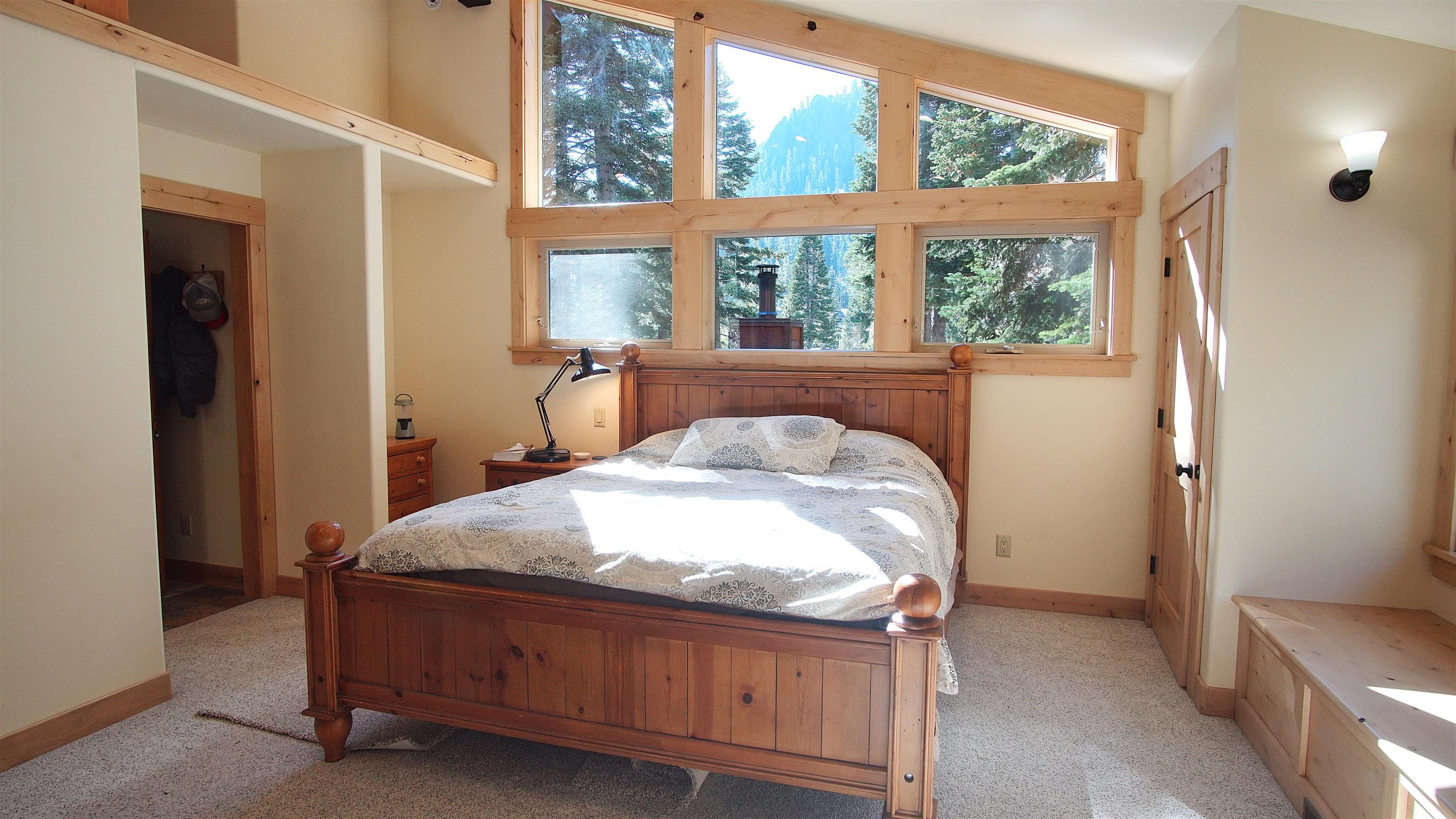 1557 Alpine Meadows Road Alpine Meadows, CA 96146 - Photo 25 of 28 a bed sitting in a bedroom next to a window
