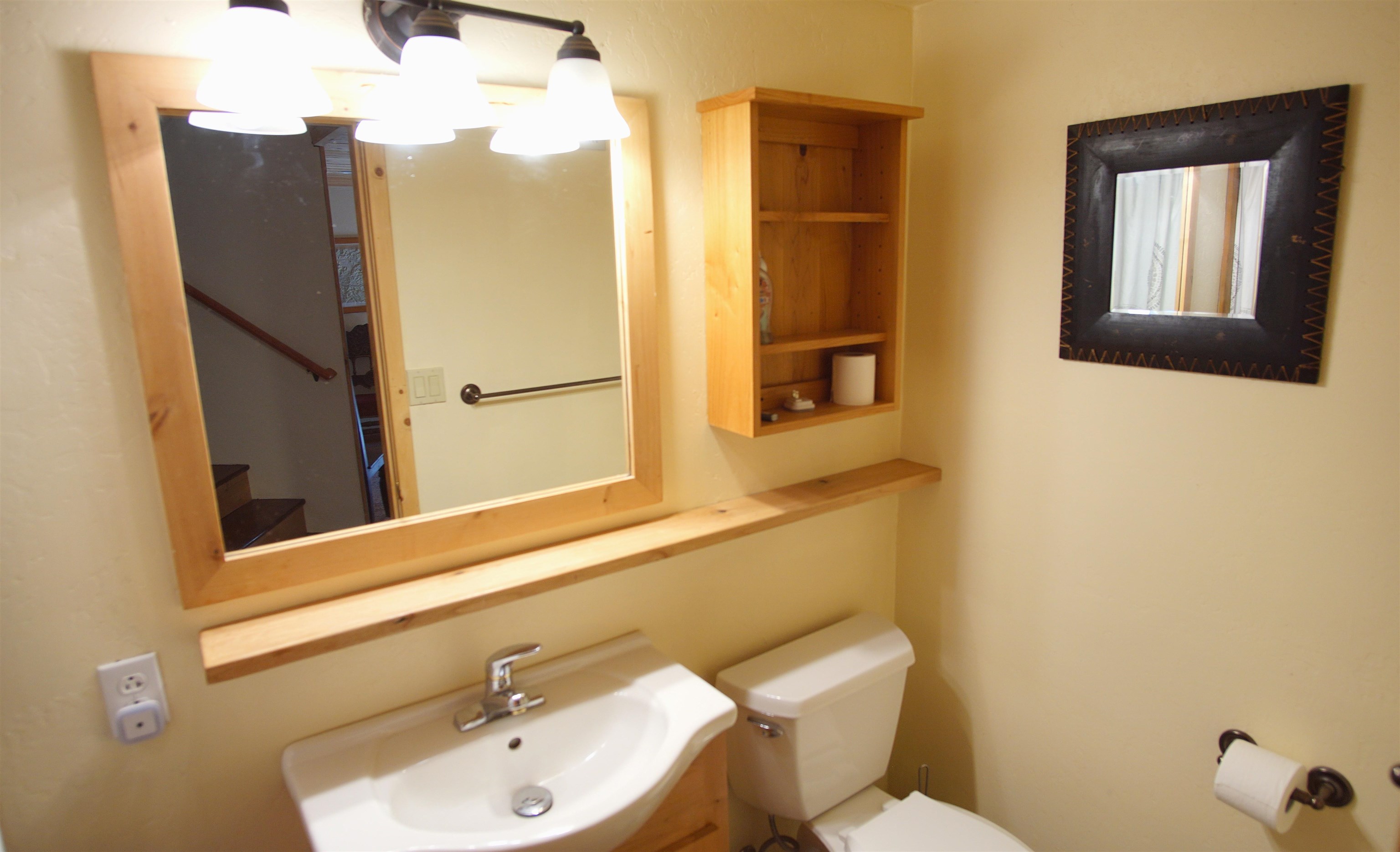 1557 Alpine Meadows Road Alpine Meadows, CA 96146 - Photo 27 of 28 a bathroom with a sink and mirror