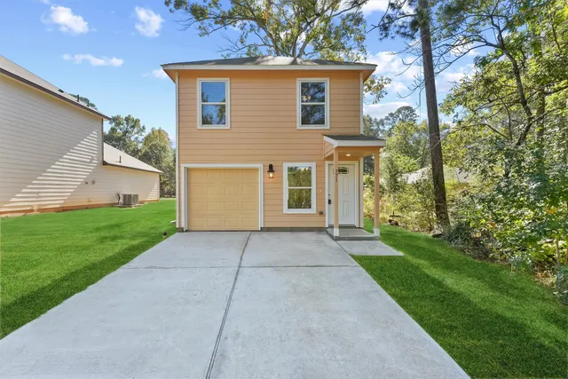 front view of a house with a yard