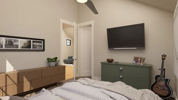 a bedroom with a bed and a flat screen tv