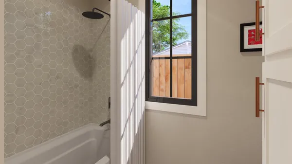 a bathroom with a bathtub and shower