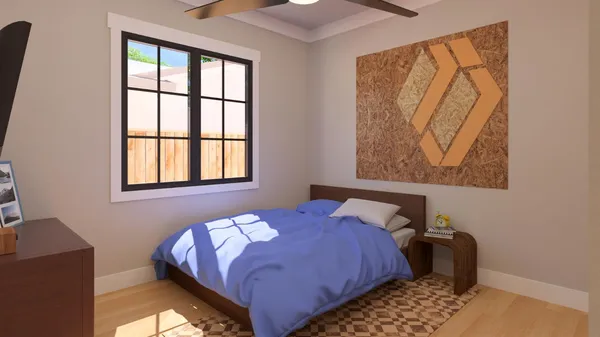 a bedroom with a bed and a window