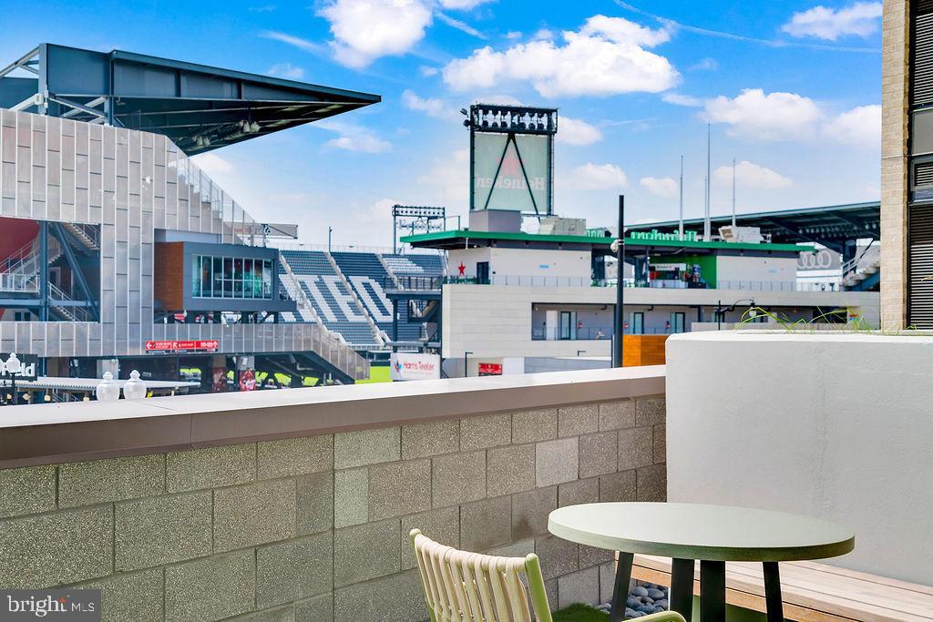 113 Potomac Avenue Southwest, Unit 532 Washington, DC 20024 - Photo 49 of 50 a roof deck with table and chairs