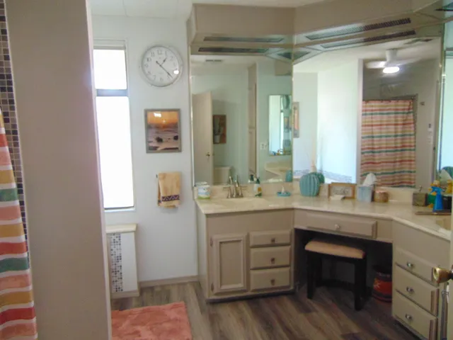 a living room with a flat screen tv and a fireplace