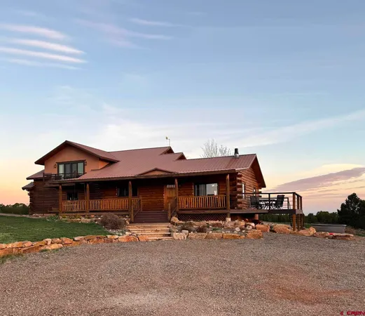a view of a dining room with furniture and window
