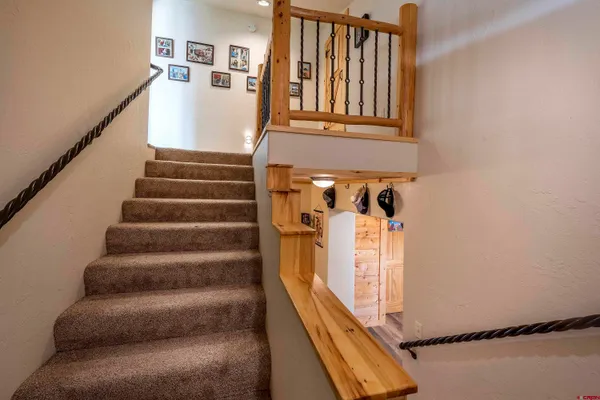 a view of a roof deck with table and chairs