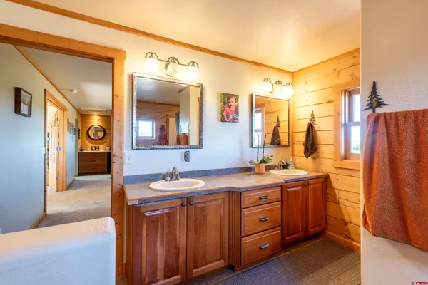 a view of a patio with table and chairs with wooden floor and fence