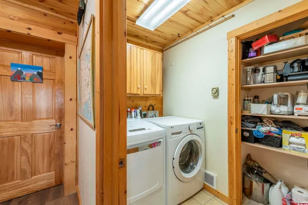 a bedroom with a bed furniture and a book shelf