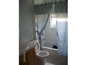 1320 Southeast Ran Palm Bay, FL 32909 - Photo 7 of 8 a bathroom with a sink and toilet