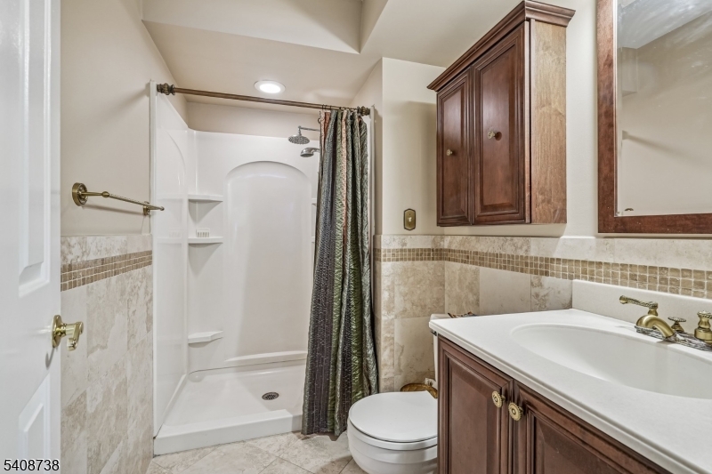 27 Espy Road, Unit A7 Caldwell, NJ 07006 - Photo 15 of 29 a bathroom with a sink toilet and shower