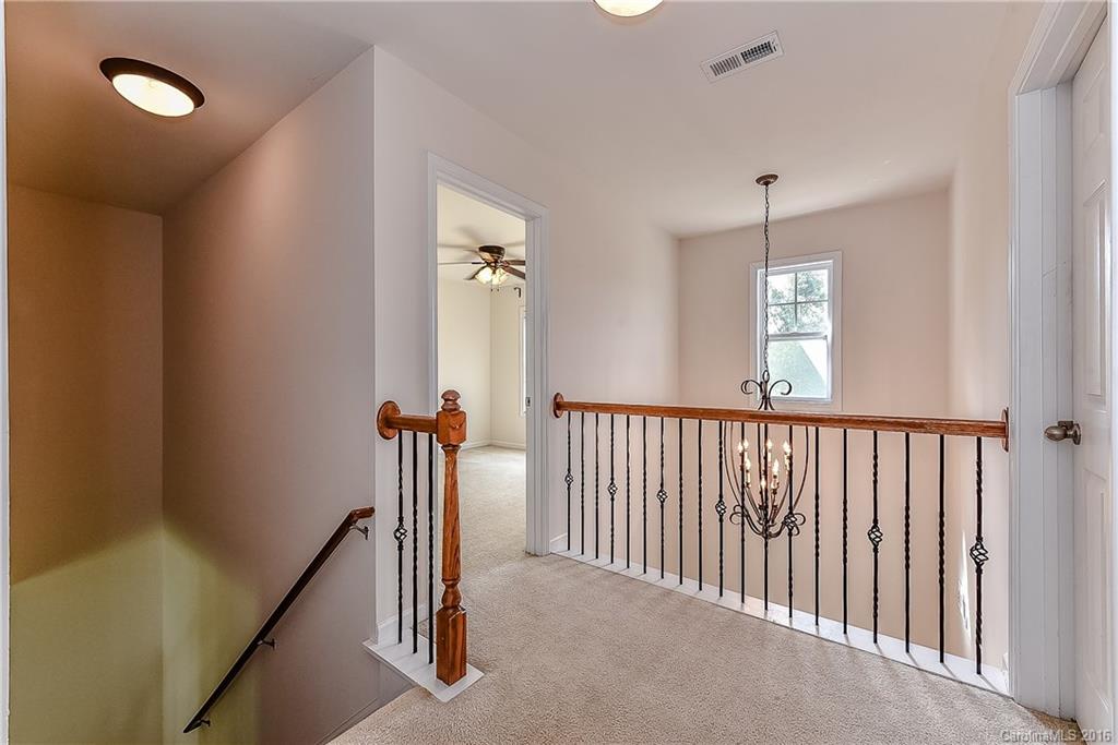 3111 Gloxinia Road Charlotte, NC 28215 - Photo 14 of 24 a view of a hallway with a door
