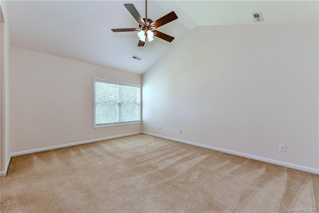 3111 Gloxinia Road Charlotte, NC 28215 - Photo 15 of 24 an empty room with a window and a fan