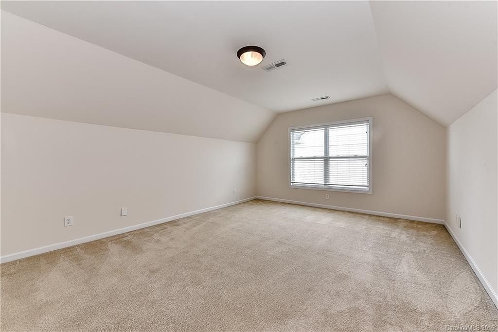 3111 Gloxinia Road Charlotte, NC 28215 - Photo 22 of 24 an empty room with windows
