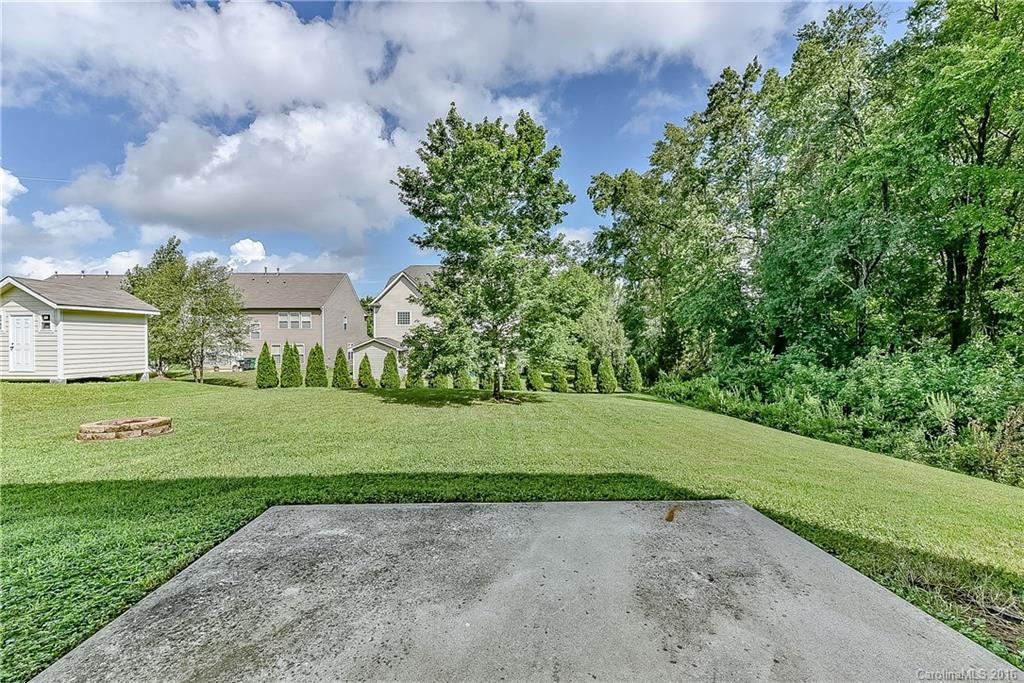 3111 Gloxinia Road Charlotte, NC 28215 - Photo 23 of 24 a view of a house with a yard