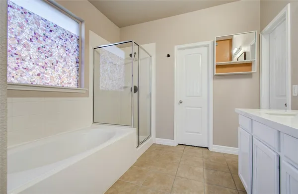 a front view of a house with a big yard