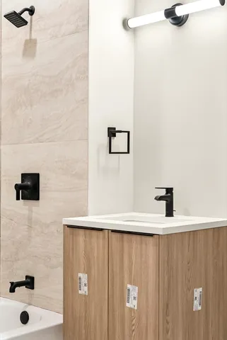 a bathroom with a bathtub and a shower