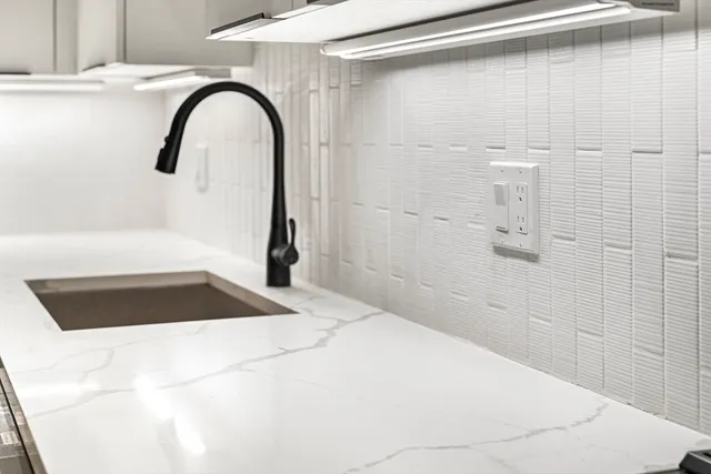 a bathroom with a bathtub and shower