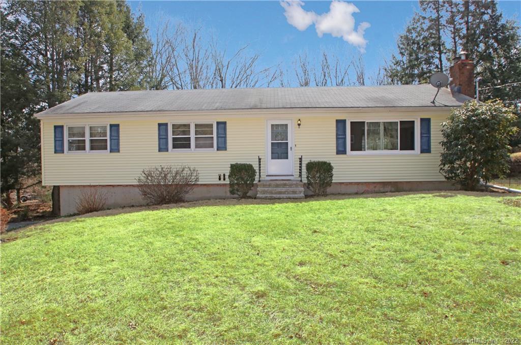 264 Strongtown Road Southbury, CT 06488 - Photo 1 of 1 a front view of house with yard and green space